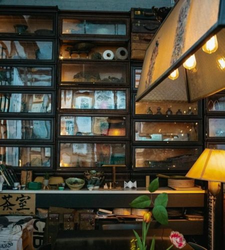 Japanese tea room interior with traditional displays and warm lighting, illustrating Japanese cultural identity and historical memory